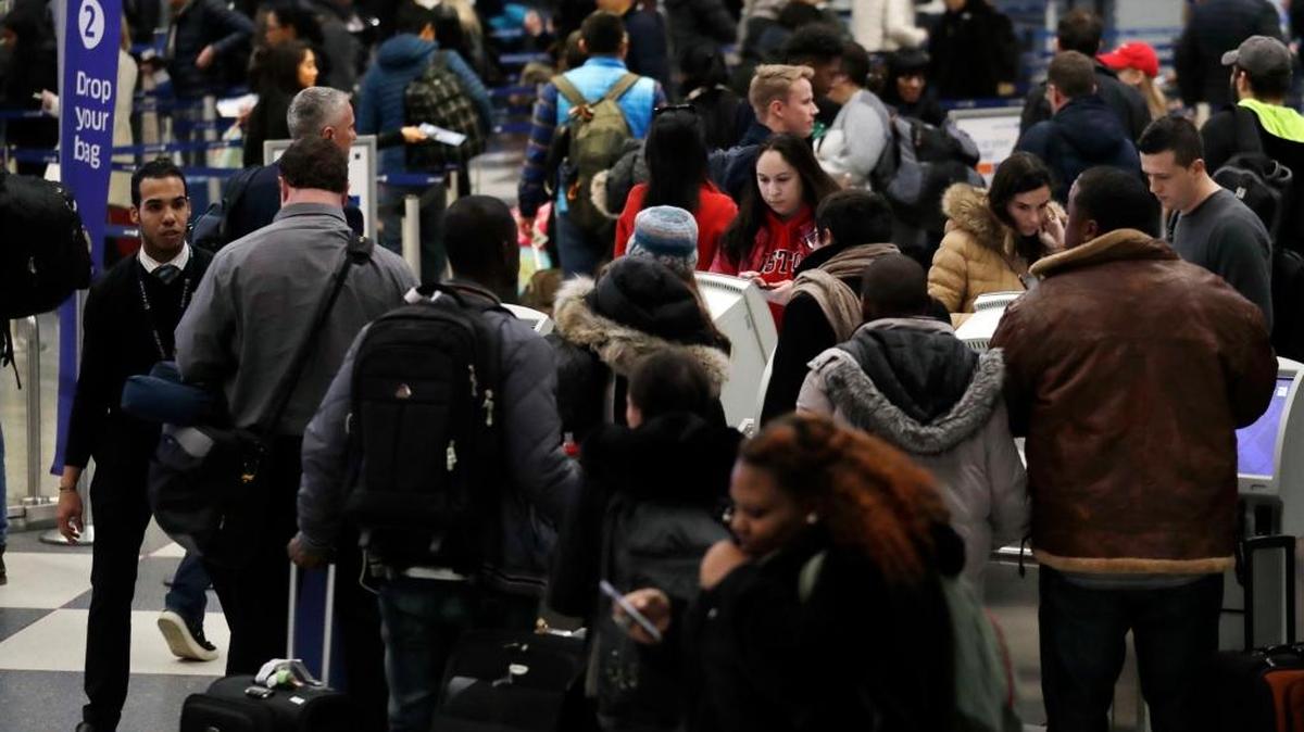 Travelers check and walk in Terminal 1 at O’Hare International Airport. Two people with measles traveled through the airport the Jan. 9.