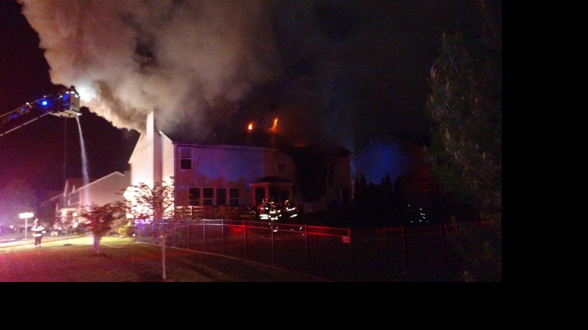 
Flames peek through vents in the roof of this home on Calista Ridge Drive in Shiloh Friday night.
