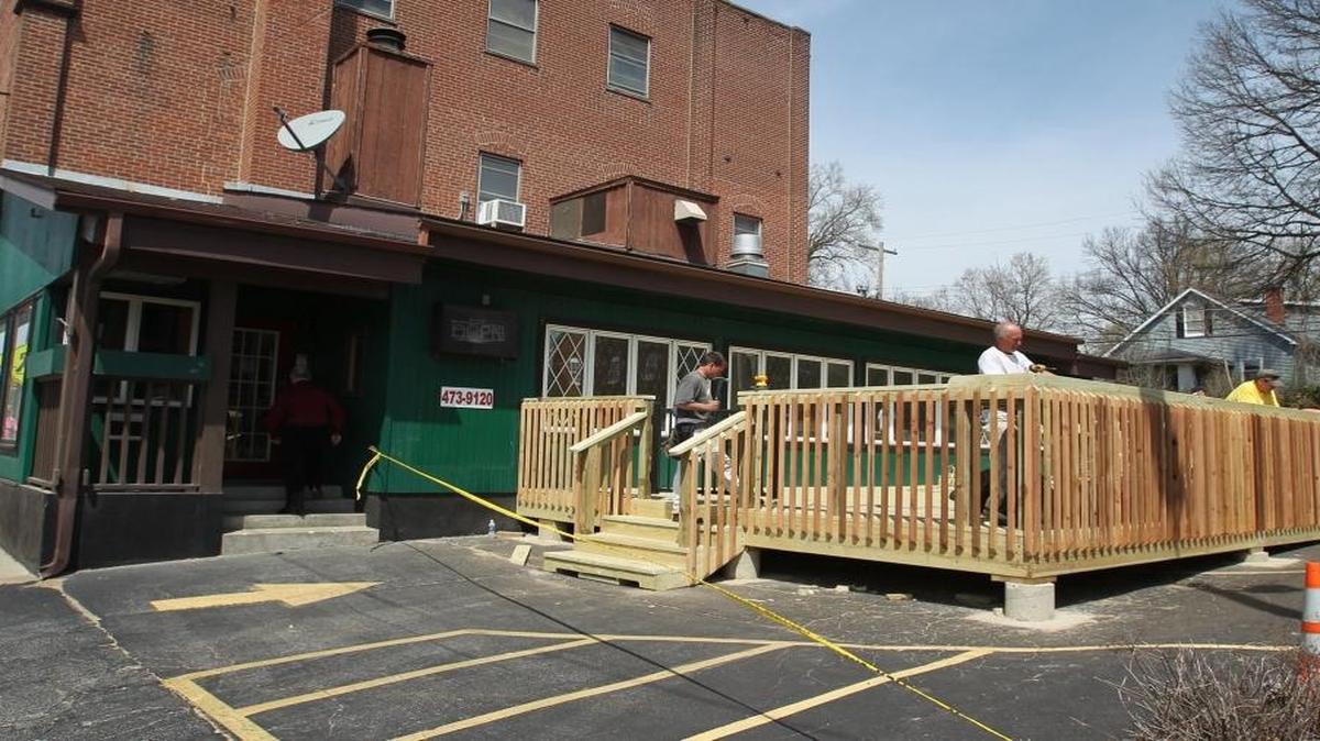Workers put the finishing touches on a deck built onto the building at 923 W. Main St. in Belleville in 2014, ahead of Flamingo’s Restaurant’s opening in the building that once housed Maxwell’s Restaurant. Now, the building will house The Red Onion, which will open for lunch April 14.