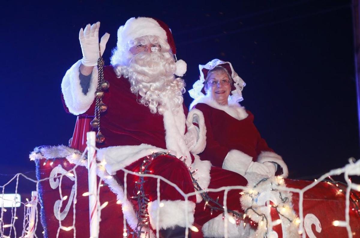 Santa Claus and Mrs. Claus wave during the O’Fallon Illuminated Christmas Parade in 2017. For the 2020 holiday season, COVID-19 circumstances have caused the city create a crossover-type event with the O’Fallon Station Winter Market&nbsp;and the Chamber of Commerce’s Tinsel Around Town downtown events.