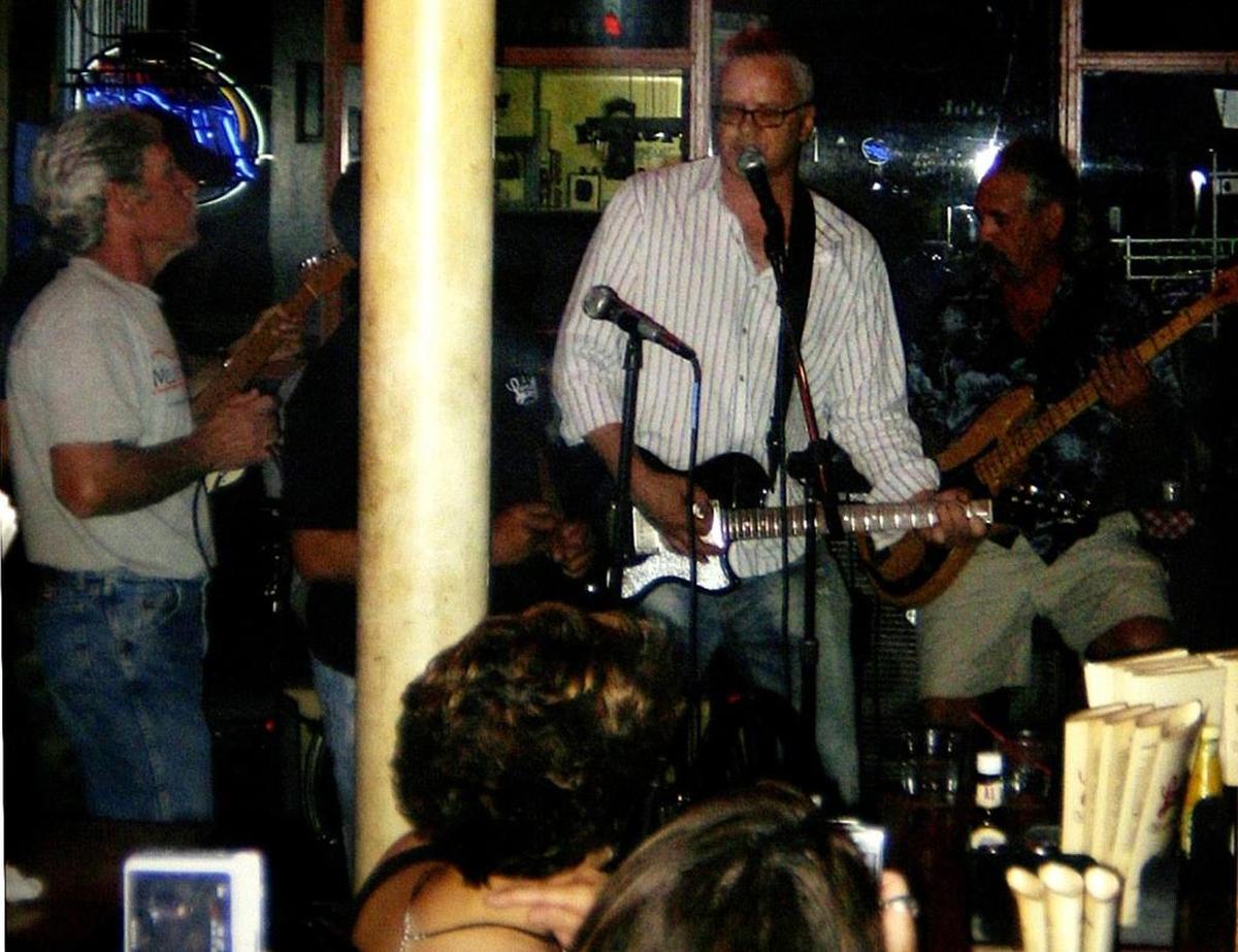 Actor Tim Robbins plays with members of the Mo’ Pleasure Band at Laurie’s Place in Edwardsville on June 5, 2008.