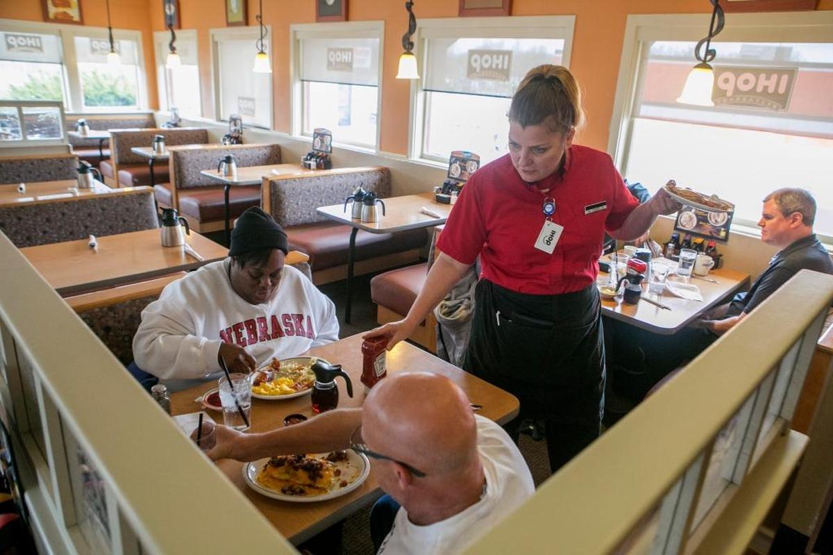 Waitress Carmella Parks helps customers inside the Belleville IHOP.