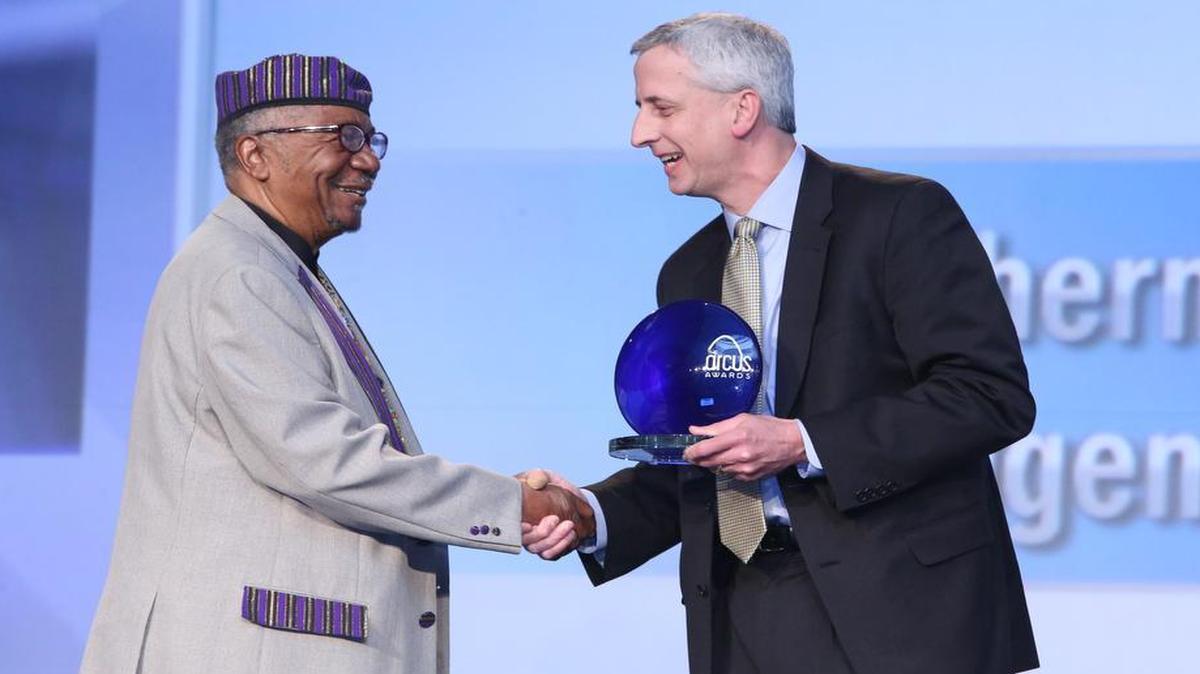 Eugene B. Redmond, SIUE emeritus professor in the Department of English Language and Literature, author, editor and Poet Laureate of East St. Louis, on the left, receives the Arcus People’s Choice Award from John Herber, Jr., managing partner at RubinBrown LLP.