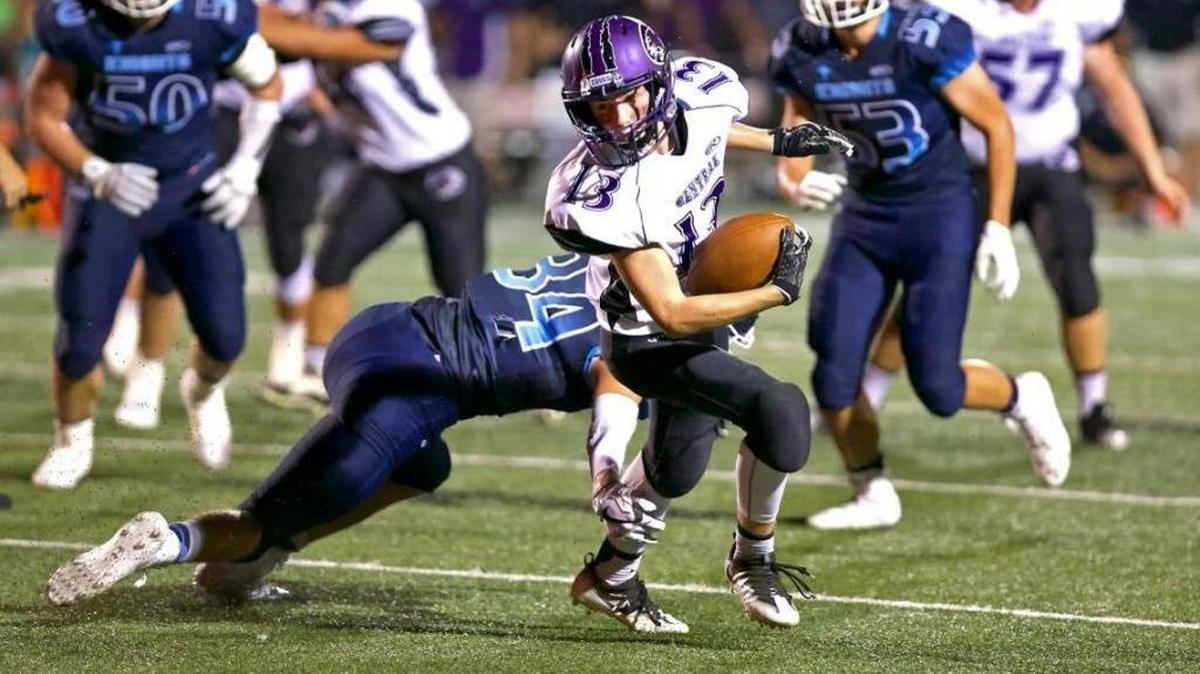 Central Cougars’ Garrett Richter (13) breaks away from Mater Dei Lucas Theising (34) during the Milk Bowl game at Mater Dei High School last year. The Breese rivarly will be renewed Friday at Central.