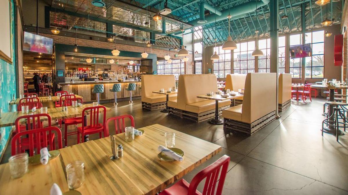 Punch Bowl Social’s restaurant in Minneapolis has an industrial look with high ceilings, exposed duct work and factory-style windows. The company plans to open a location in St. Louis next year with bowling, virtual-reality gaming and other entertainment.