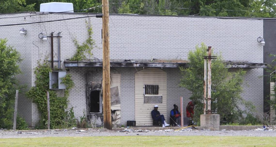 People who loiter outside liquor stores are a potential danger to children, say who advocate reducing the number of liquor licenses available in East St. Louis.