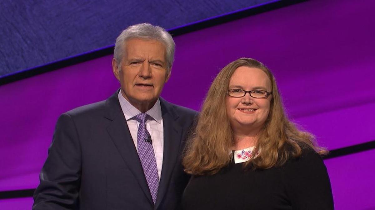 Kelly Lasiter poses with Jeopardy host Alex Trebek on the game show’s set in late March. The Granite City woman won her first game and took home $22,800.