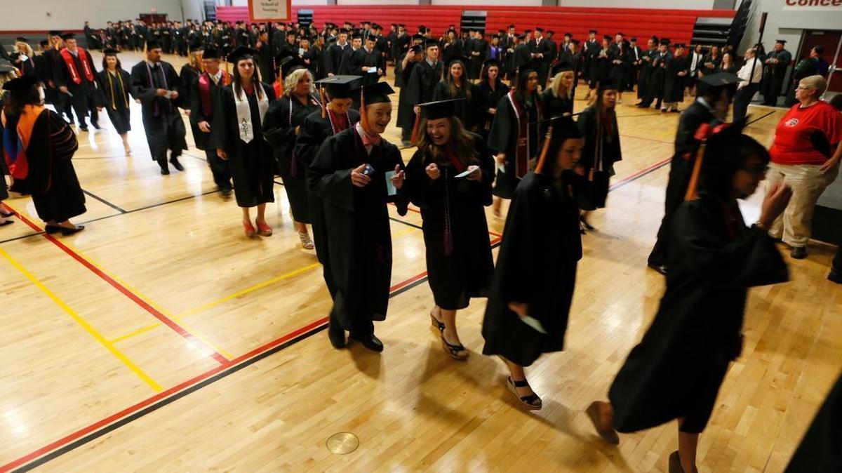 
Members of the Class of 2014 make their way to the commencement ceremony at Southern Illinois University-Edwardsville.
