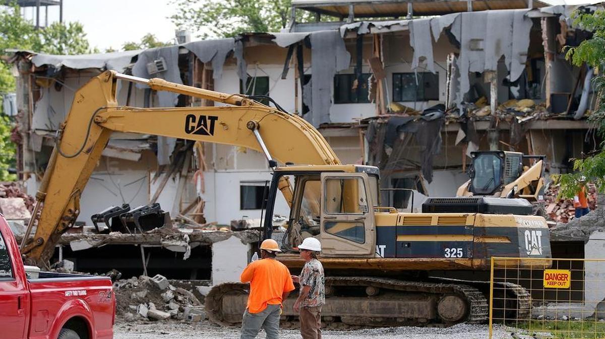 
The Martha Manning Warehouse and Main Square Apartments were being demolished Tuesday to make way for a new park called the Garden District which will include the historic Collins House which will be moved several hundred feet to be within the new attraction in downtown Collinsville.
