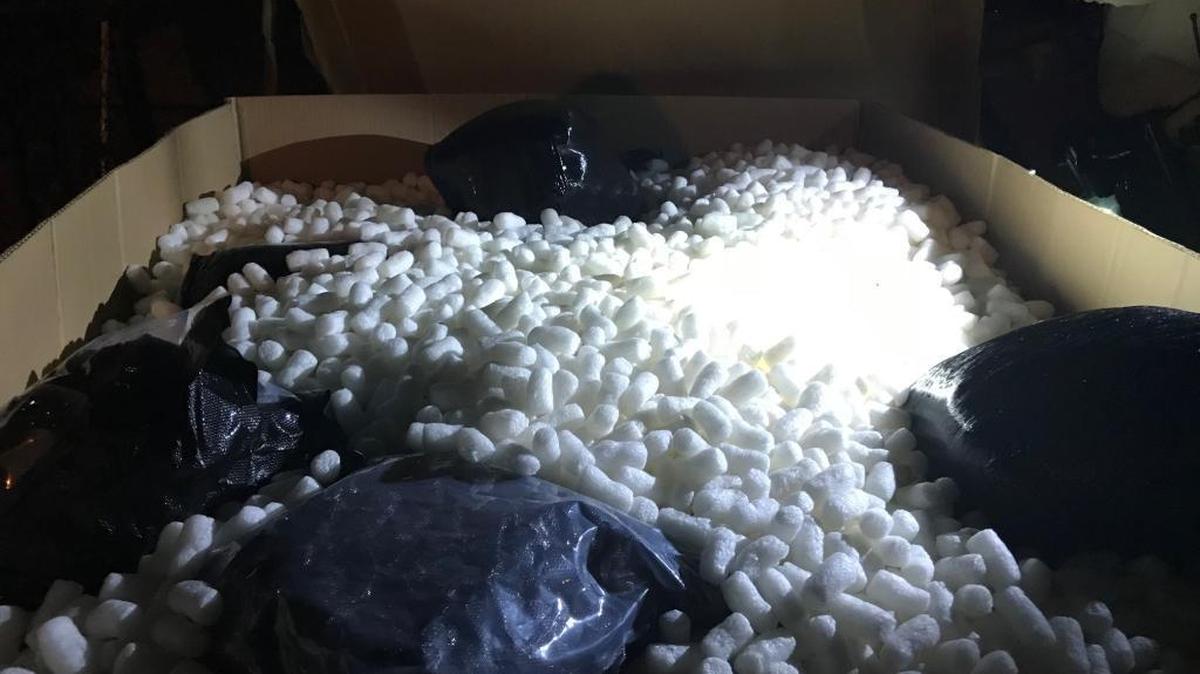 A large cardboard box containing 340 pounds of marijuana was found by an Illinois State Police dog Monday night outside a vacant house on 10th Street in East St. Louis.