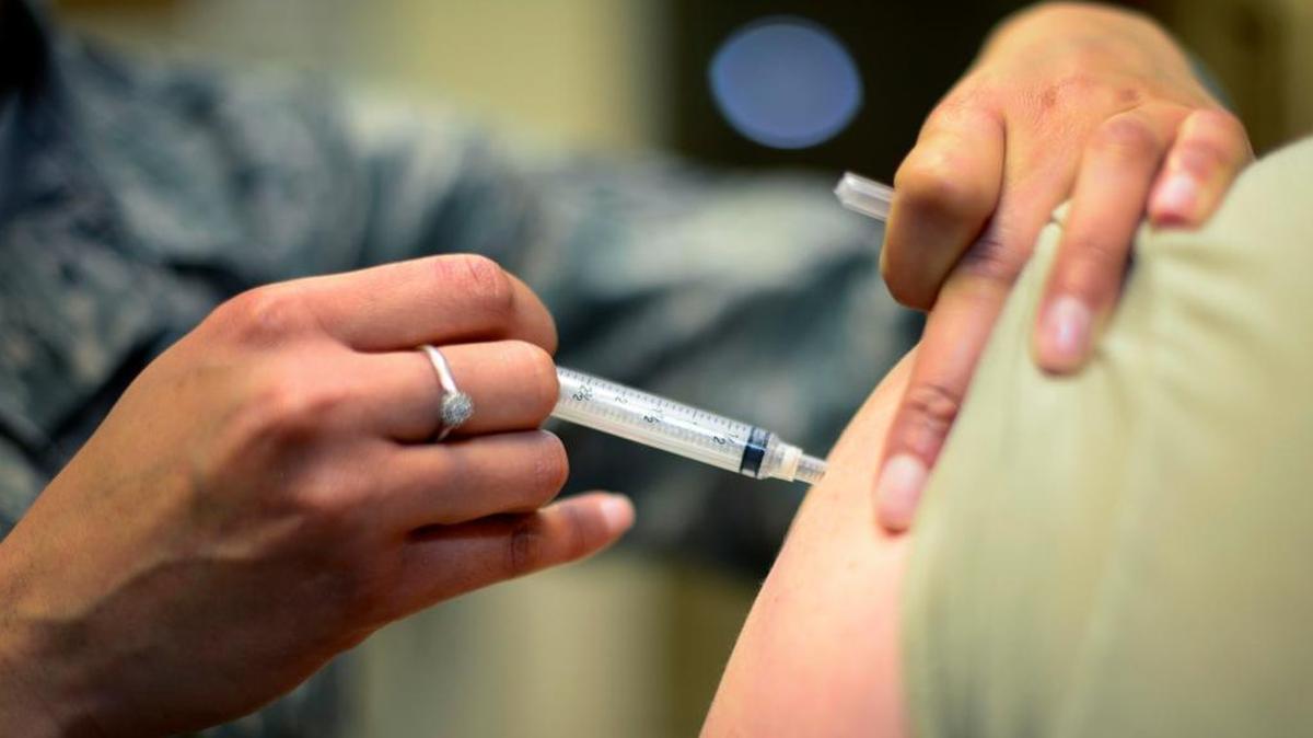 U.S. Air Force Staff Sgt. Bianca Raleigh administers a patient’s shot March 23, 2015, at Aviano Air Base, Italy.