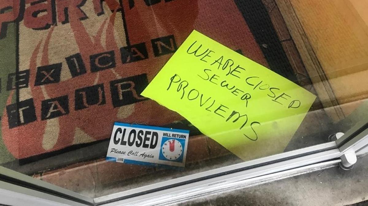 A sign on the door at La Parrilla Mexican Restaurant in O’Fallon said the establishment was closed due to sewer problems.