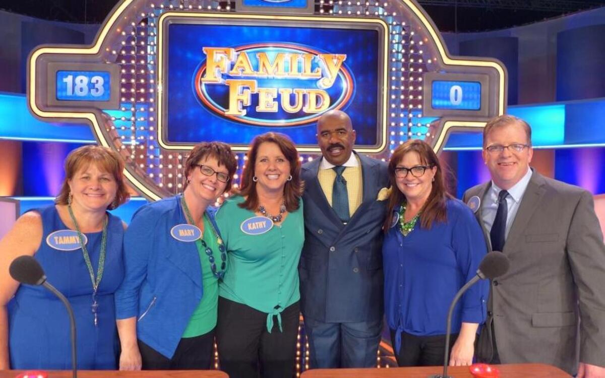 The Shaffer family of Waterloo will appear in an upcoming episode of “Family Feud.” From left, Tammy Slager, Mary Beard, Kathy Warren, show host Steve Harvey, Nancy Quernheim and Bill Wirth pose during a show taping last year in Atlanta.
