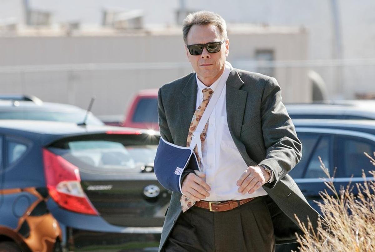Circuit Judge Ronald Duebbert walks to the Belleville Police Department on Wednesday morning. Duebbert was officially booked on charges of criminal sexual abuse and intimidation plus two misdemeanors alleging in part that he grabbed a client’s genitals and offered to reduce a legal fee by $100 if the man would perform a sex act on him.