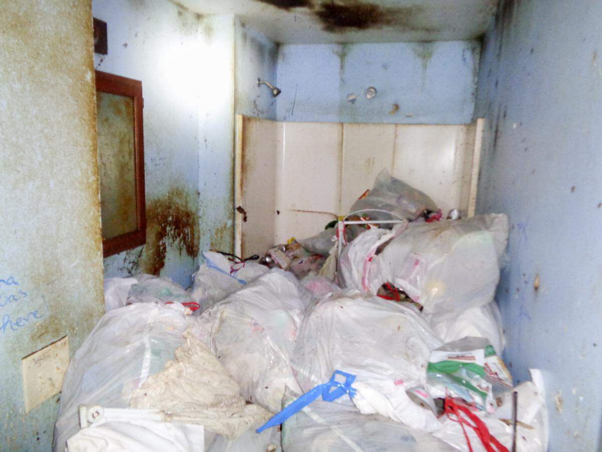 Main bathroom of the Elkinses' family home in New Douglas was unusable because it was filled with trash.