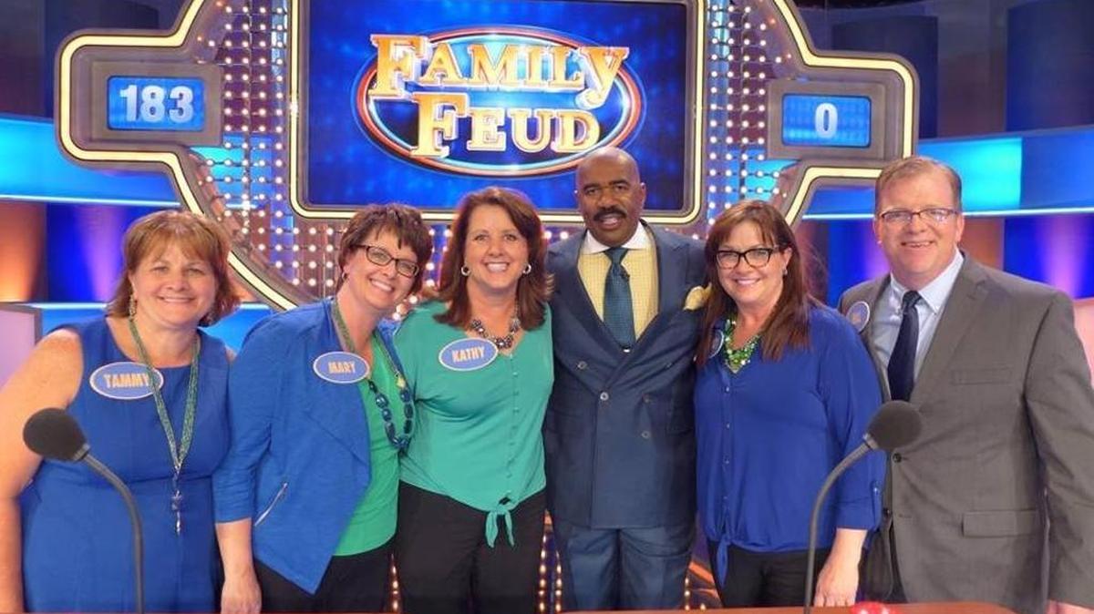 The Shaffer family of Waterloo appeared in three episodes of “Family Feud.” From left, Tammy Slager, Mary Beard, Kathy Warren, show host Steve Harvey, Nancy Quernheim and Bill Wirth pose during a show taping last year in Atlanta.
