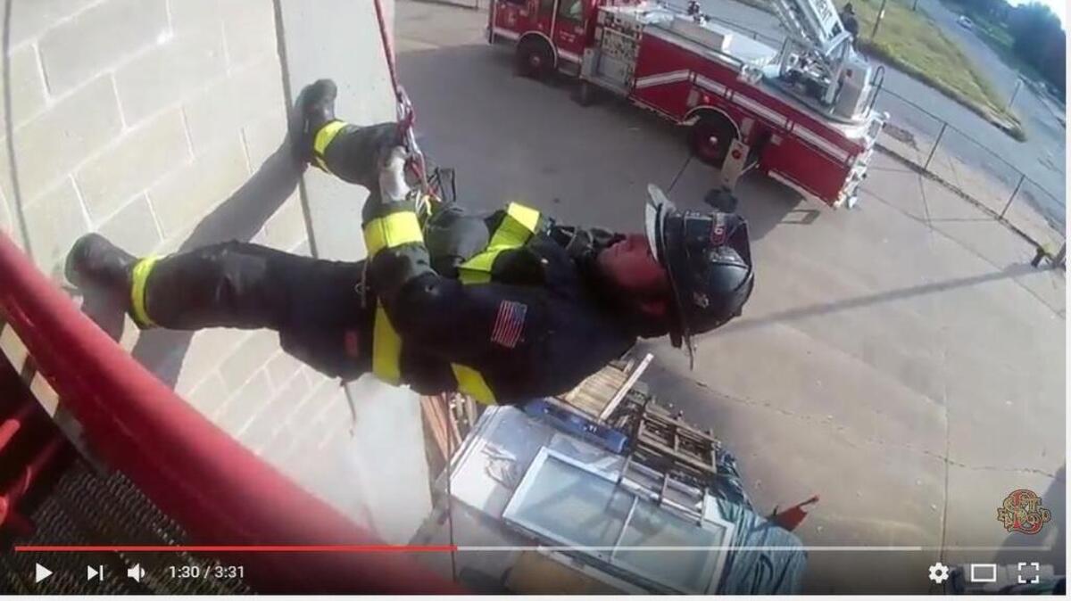 As shown in a screenshot, a St. Louis firefighter participates in the Mannequin Challenge. The fire department posted its video on Monday to YouTube and Facebook.