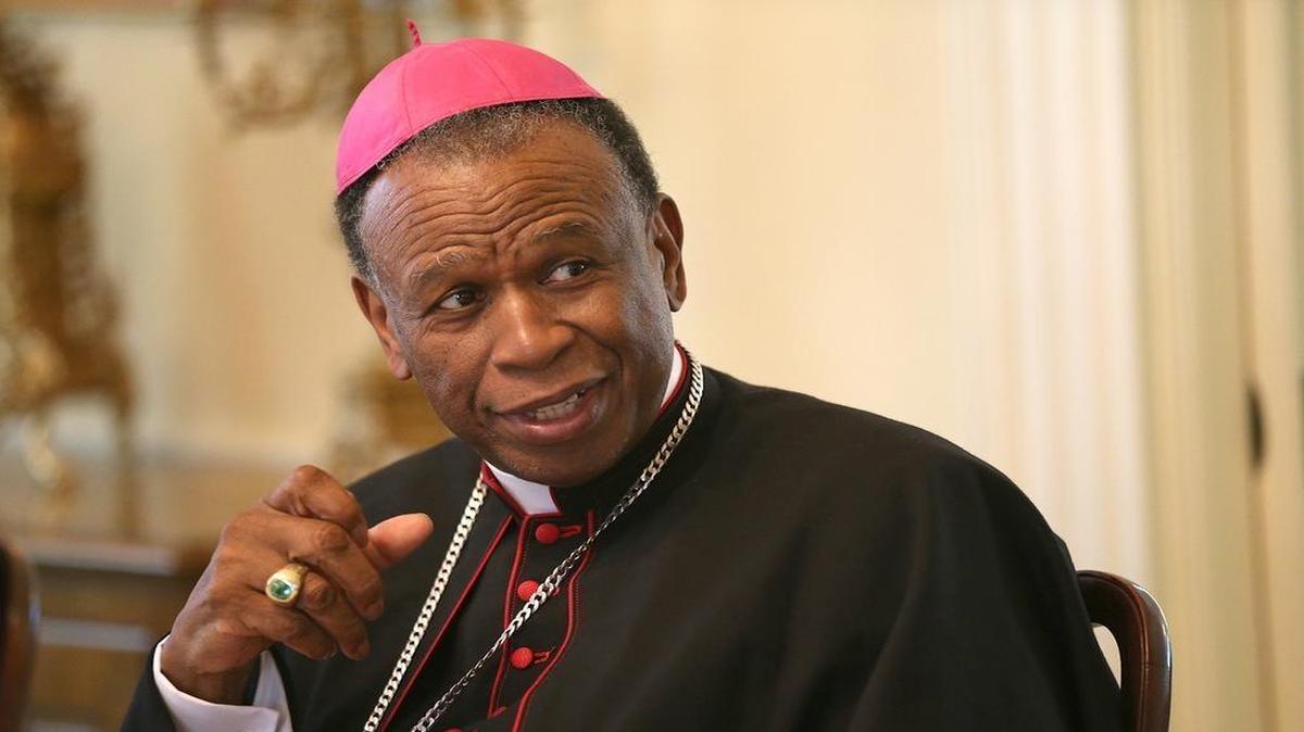 
Most Rev. Edward K. Braxton listens to a comment from a guest during a luncheon at the Bishop's residence.
