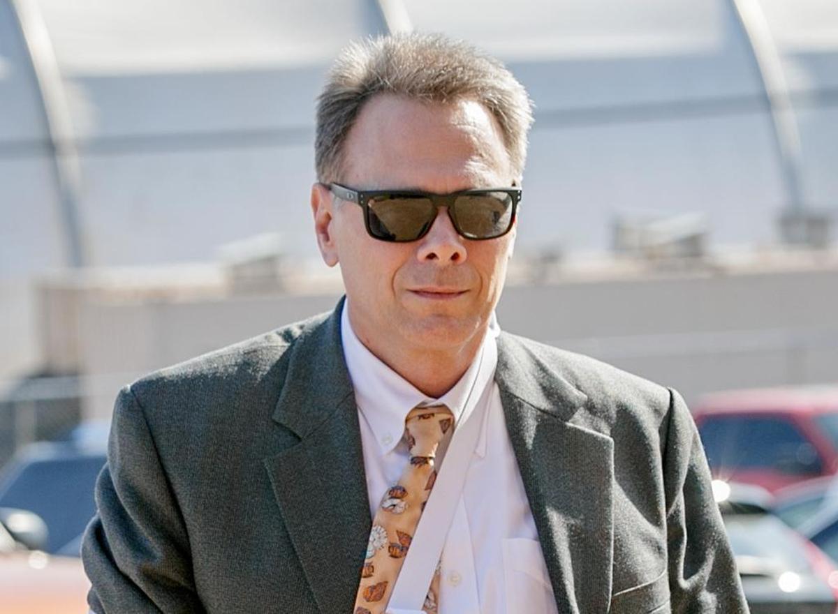 Circuit Judge Ronald Duebbert walks to the Belleville Police Department on Wednesday morning. Duebbert was officially booked on charges of criminal sexual abuse and intimidation plus two misdemeanors alleging in part that he grabbed a client’s genitals and offered to reduce a legal fee by $100 if the man would perform a sex act on him.