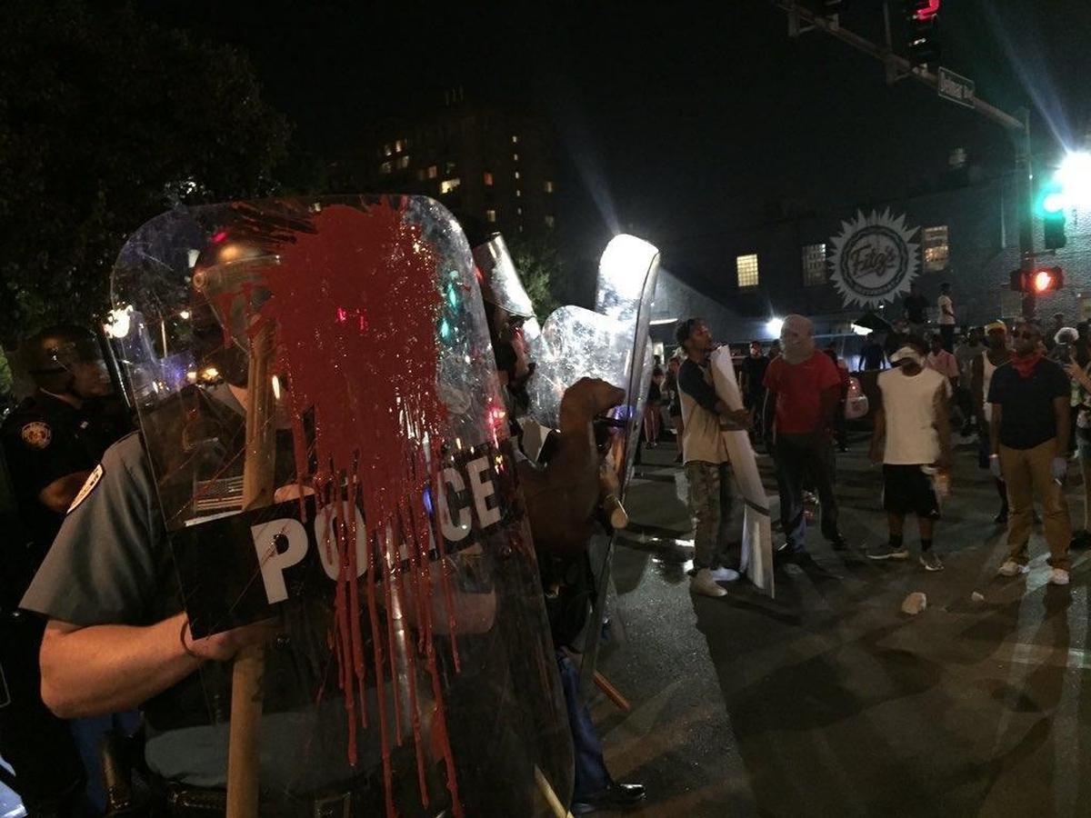 Some protesters throw paint and rocks at St. Louis police during a protest Saturday night in the Delmar Loop in University City. The protests are in response to former officer Jason Stockley being found not guilty Friday in the December 2011 shooting death of Anthony Lamar Smith.