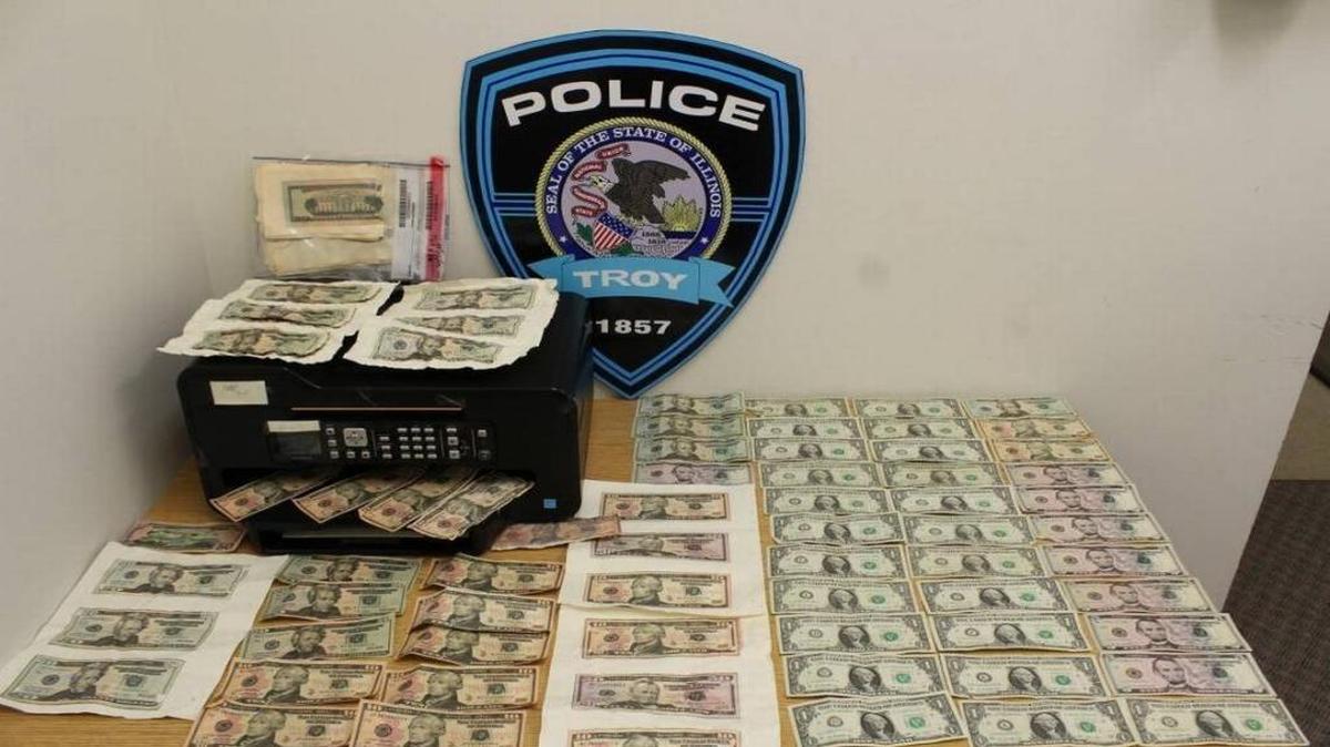 Troy Police confiscated counterfeit bills produced in a hotel room.