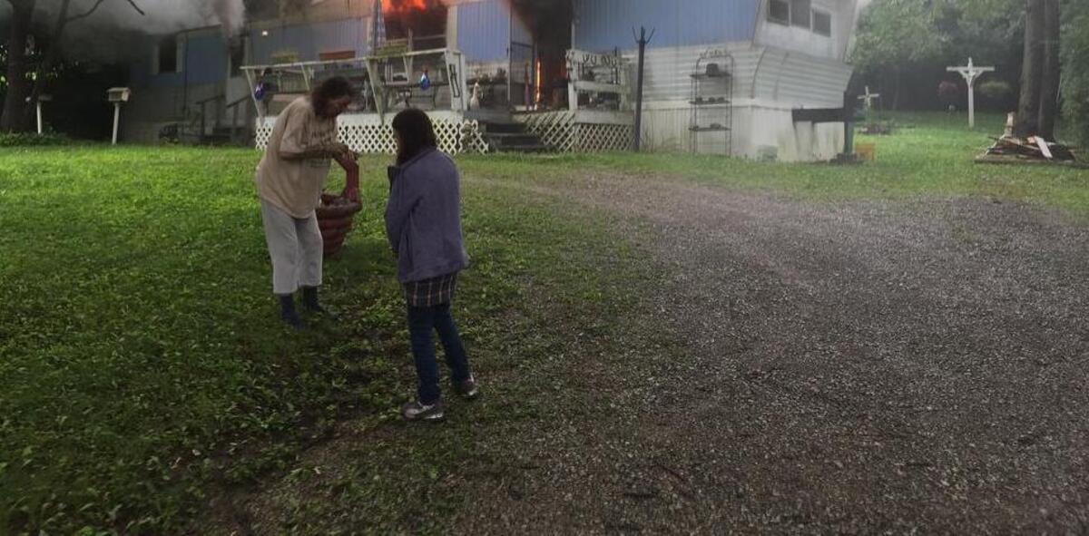 
The woman at left in white was transported to a hospital for minor injuries after her mobile home on Holly Drive in Belleville was destroyed in a fire Wednesday afternoon.
