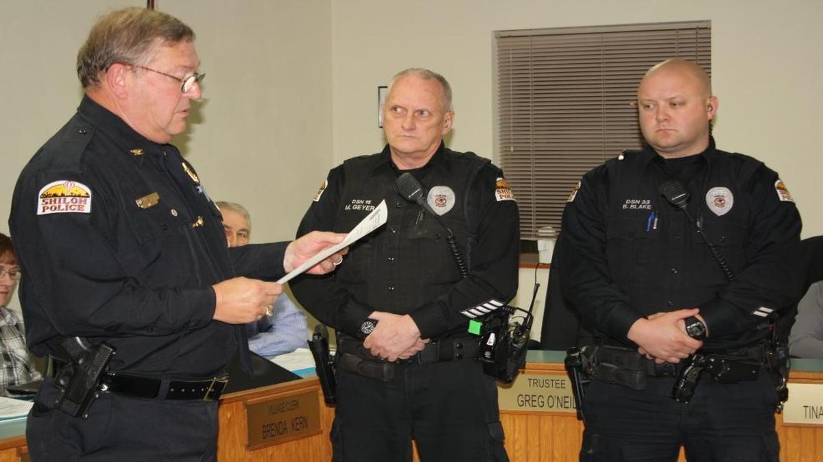 Shiloh Police Chief Jim Stover presented awards to Officer Mark Geyer and Officer Bradley Blake on Monday night during a Village Board meeting. The officers were awarded for their efforts in saving a construction worker who suffered an electrical shock in October.