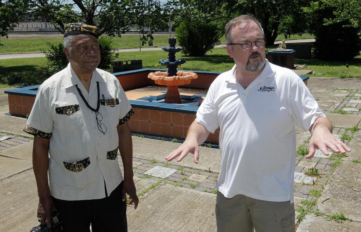 East St. Louis 1917 Centennial Commission and Cultural Initiative members Eugene Redmond, left, and Andrew Theising visit Fountain of Youth Park, a former black neighborhood and epicenter of the 1917 race riot.