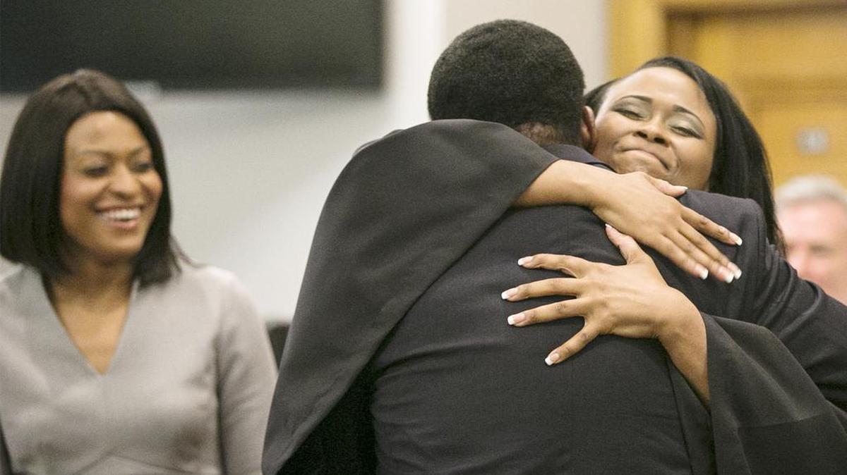 
Associate judge Jennifer Hightower hugs her father Ed Hightower after she was sworn in last Friday. Jennifer's sister Julie Hightower is at left.
