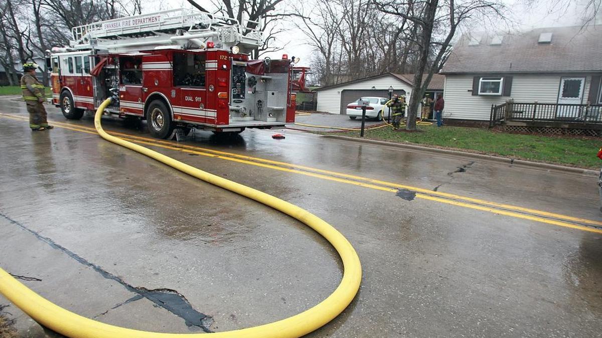 Firefighters at a burning Swansea home in the 700 bloc of Morgan Street last year.