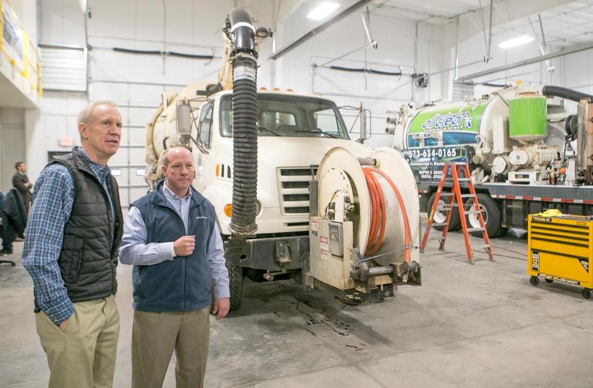 Governor Bruce Rauner speaks with Ed LeSage, owner of EJ Equipment in Troy. EJ Equipment is a street and sewer equipment specialty company.
