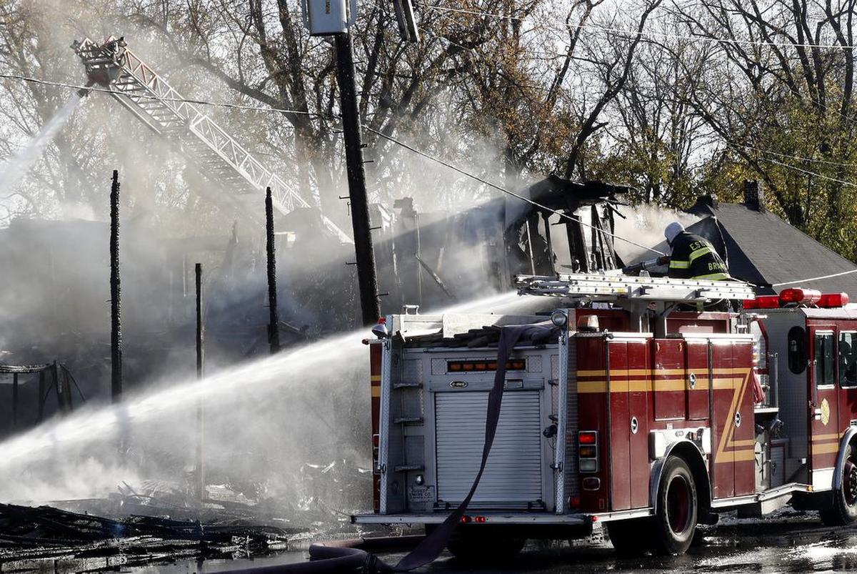 East St. Louis firefighters work at the scene of the vacant apartment complex fire at 2600 Louisiana Blvd in East St. Louis.