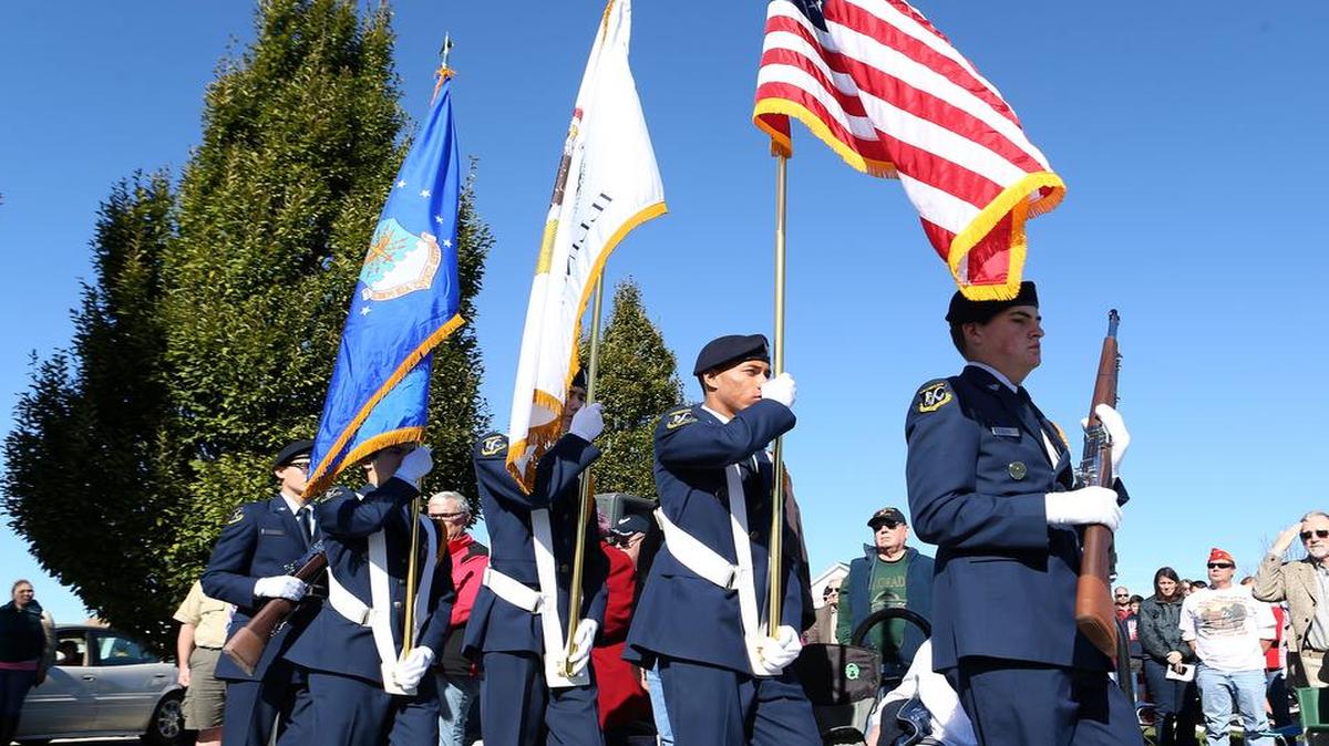 Members of the O'Fallon Township high school JROTC color guard post the colors at the beginning of the O'Fallon Veterans' Monument annual Veterans Day Ceremony.