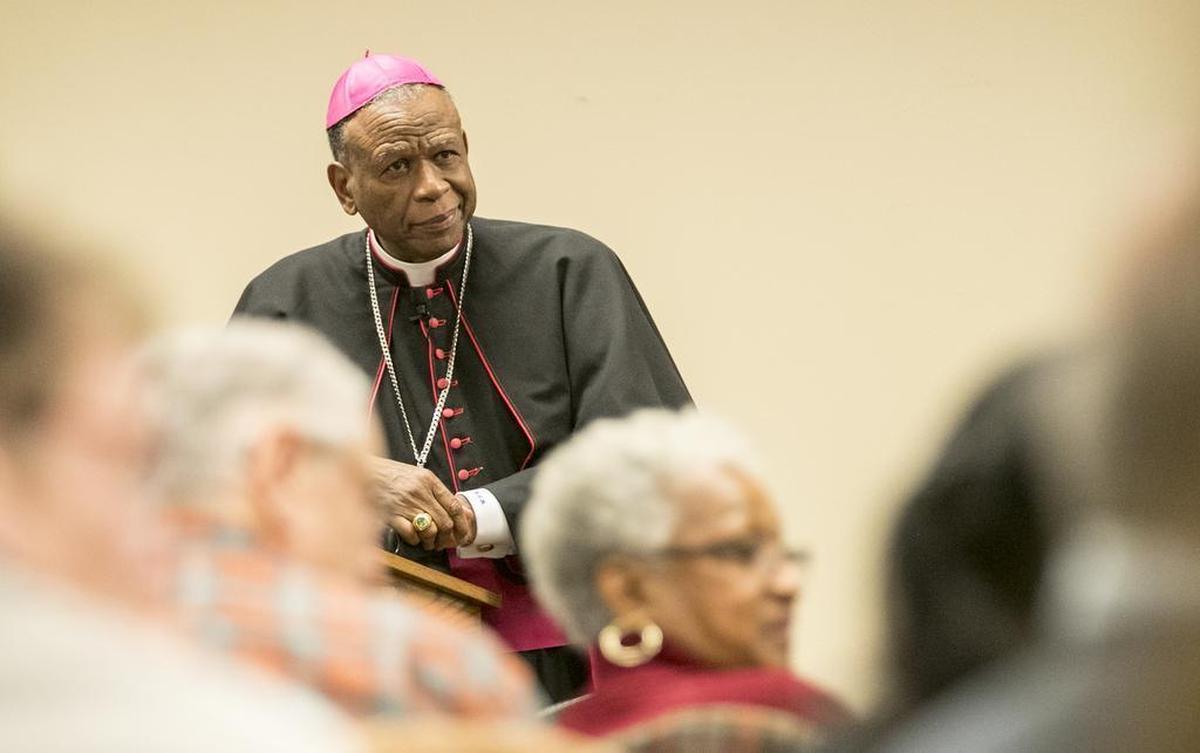 Diocese of Belleville Bishop Edward Braxton listens to questions and comments after his lecture on the racial divide in the United States at St. Clare Catholic Church in O’Fallon.