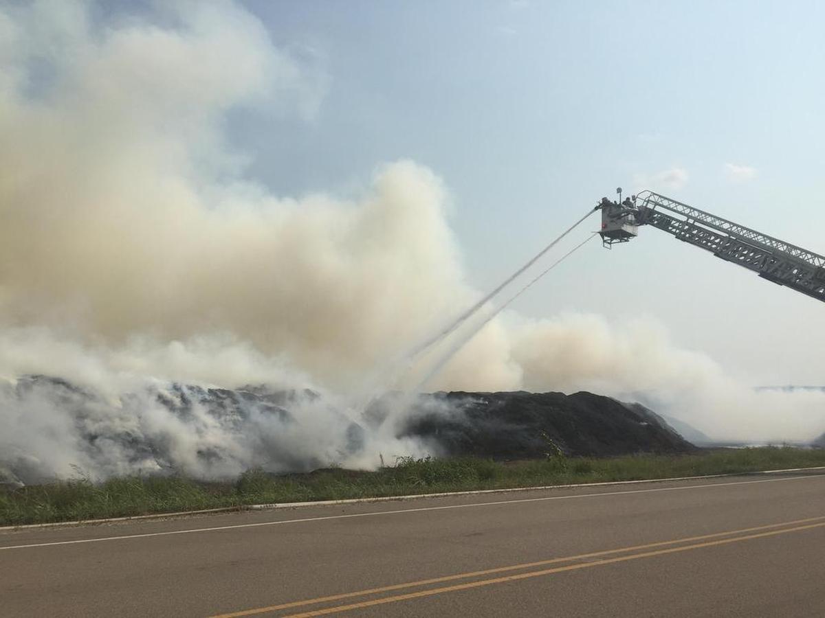 Oldcastle crews and firefighters worked together, dumping water on the piles with tankers and pouring sand on the mulch with construction equipment.