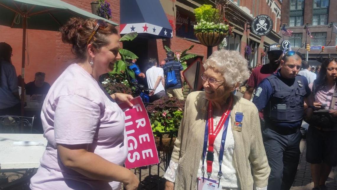Republican National Convention delegate Stella Kozanecki of Mount Vernon walks through downtown Cleveland on Wednesday. She was greeted with a “free hug” by a peaceful demonstrator.