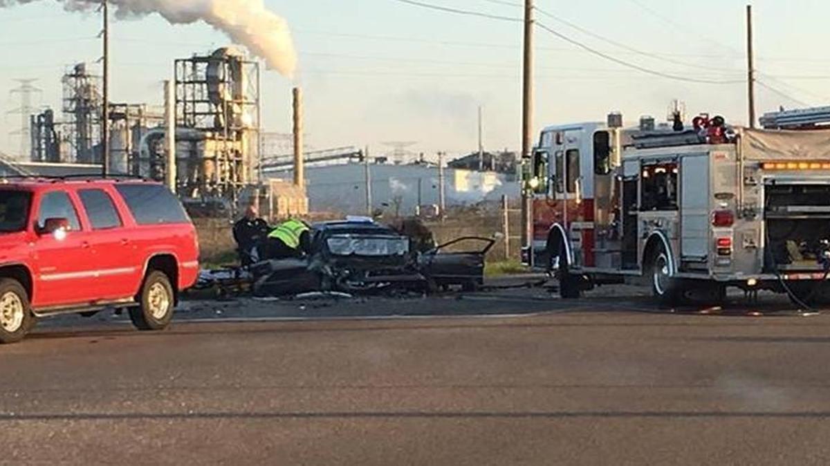 Firefighters remove the driver of a wrecked Honda from his car after a rush hour collision Tuesday morning in Sauget