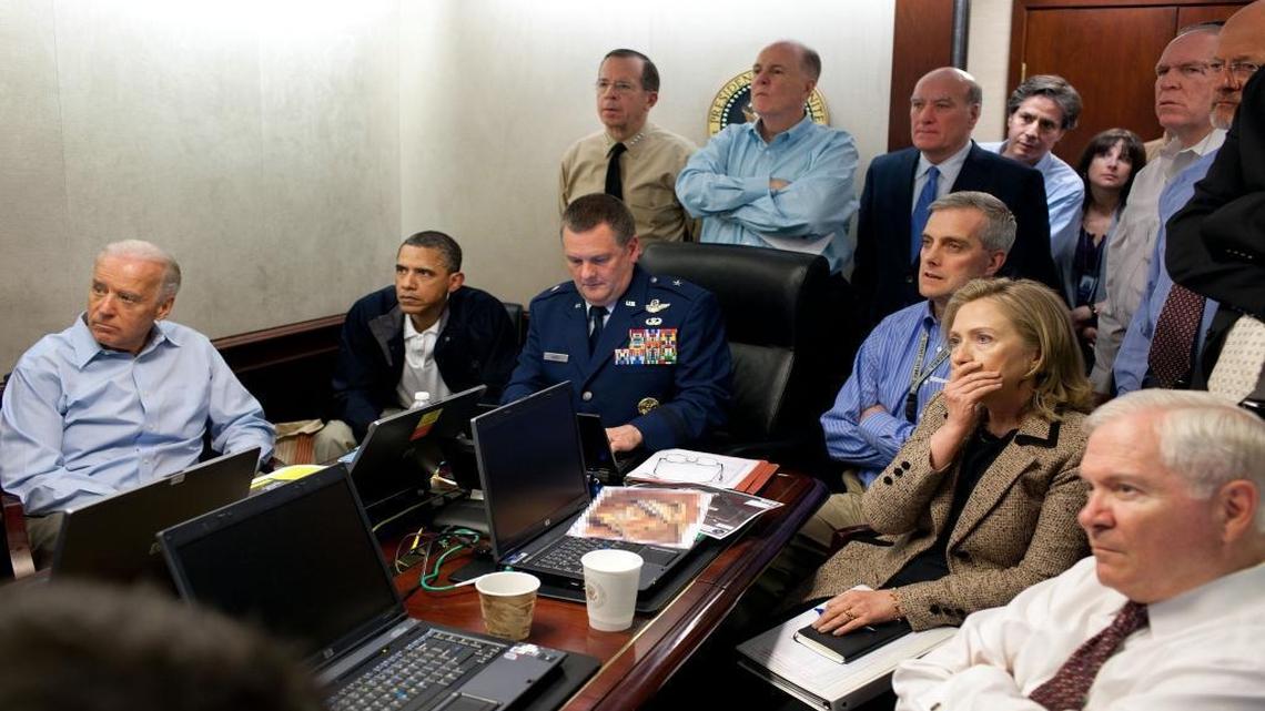 President Barack Obama and Vice President Joe Biden, along with with members of the national security team, receive an update on the mission against Osama bin Laden in the Situation Room of the White House on May 1, 2011. A classified document, prepared by the National Geospatial Intelligence Agency, is obscured in the photograph, provided by the White House. The NGA helped the Department of Defense and U.S. Intelligence community pinpoint the compound in Pakistan where bin Laden was residing. NGA worked with other intelligence agencies to create a replica of Osama bin Laden’s home in Pakistan.