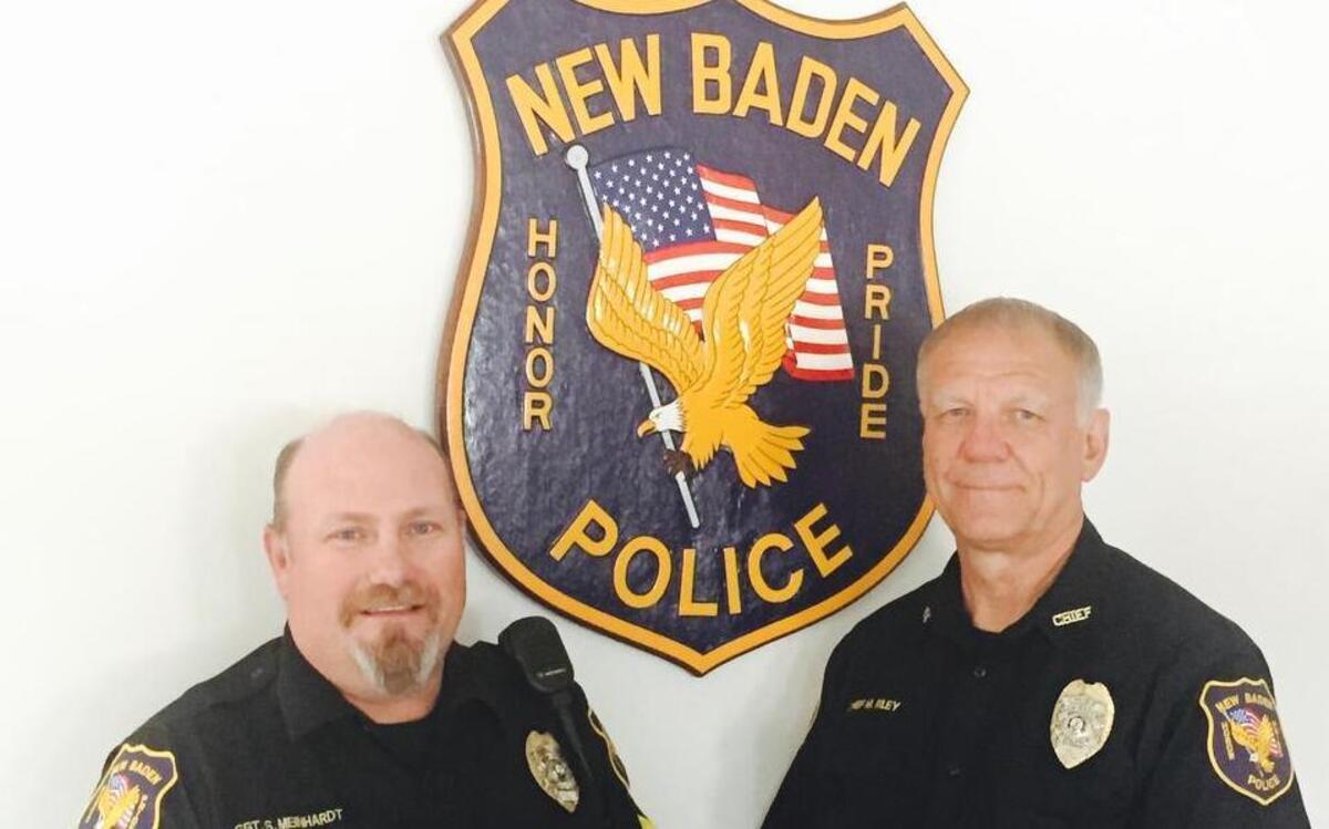 
New Baden Police Sgt. Scott Meinhardt, left, and Chief Mike Riley, right, pose together on Riley’s last day at work before he retires after over 39 years as a police officer and 36 years at the department’s helm. Meinhardt, a 25-year veteran of the force, will replace Riley as chief.
