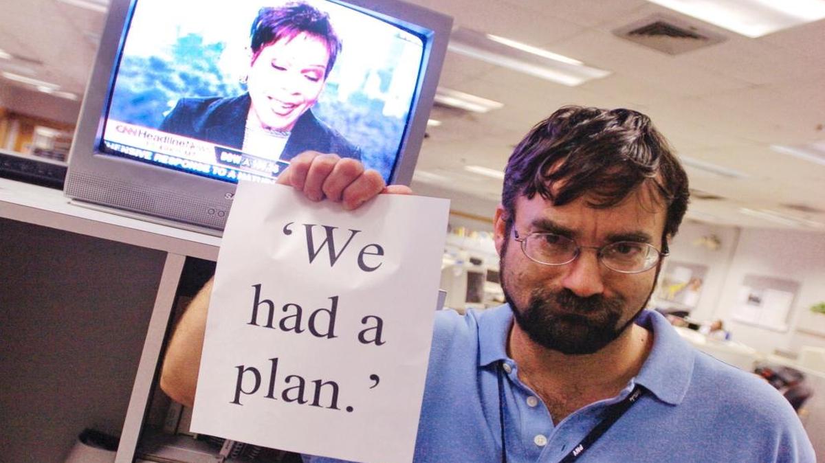 
On Sept. 6, 2005, Brad Weisenstein of the News-Democrat holds a tribute to a comment made by Biloxi Sun Herald Editor Stan Tiner during a CNN interview about the paper's post-Katrina coverage. Tiner’s nonchalant response was put on signs throughout the Sun Herald newsroom as a gag.
