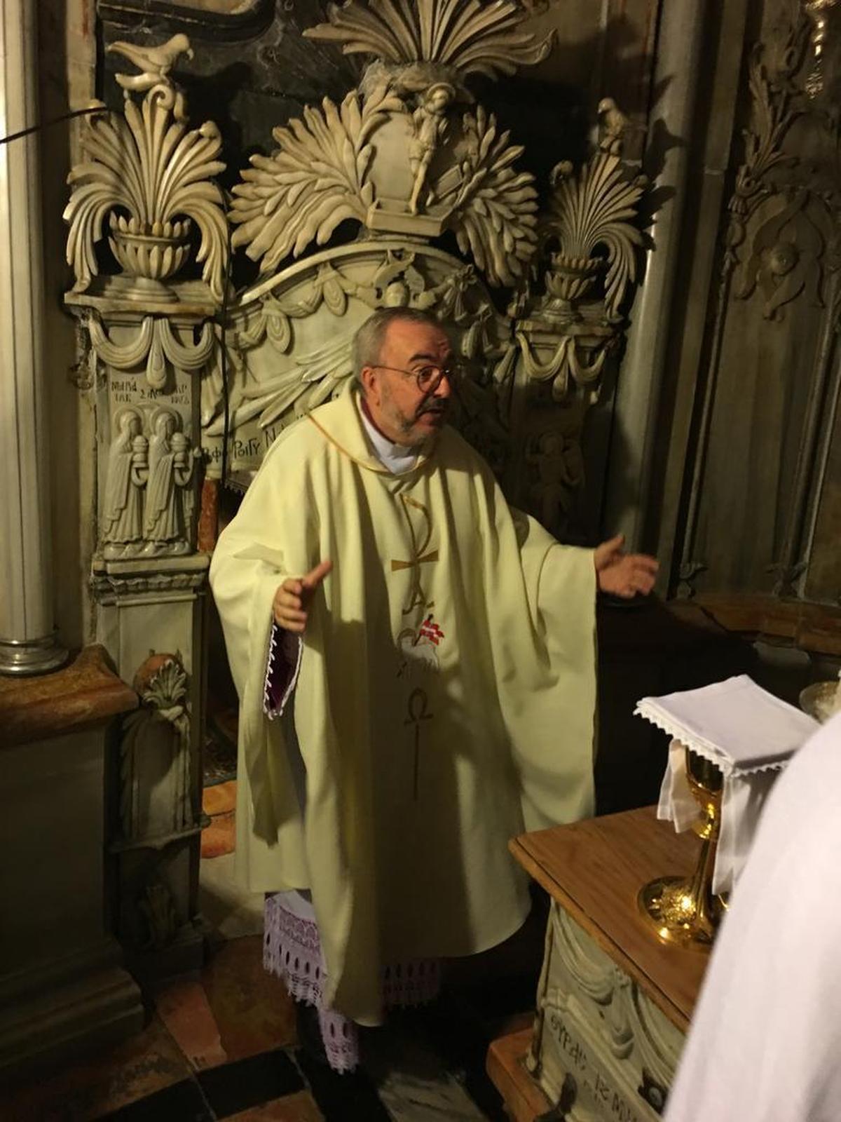 Monsignor John Myler of St. Peter Cathedral in Belleville at the Tomb of Christ in Jerusalem.