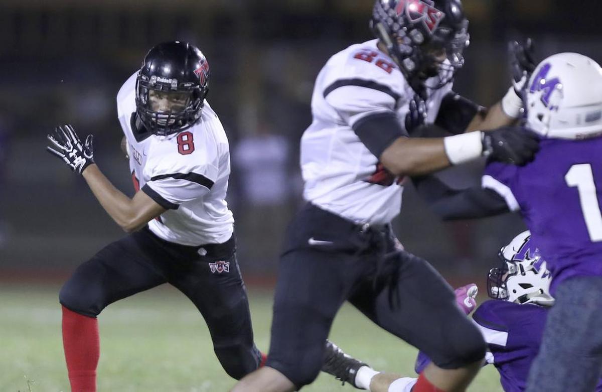 Triad’s Luke Foreman looks for a open route against Mascoutah.