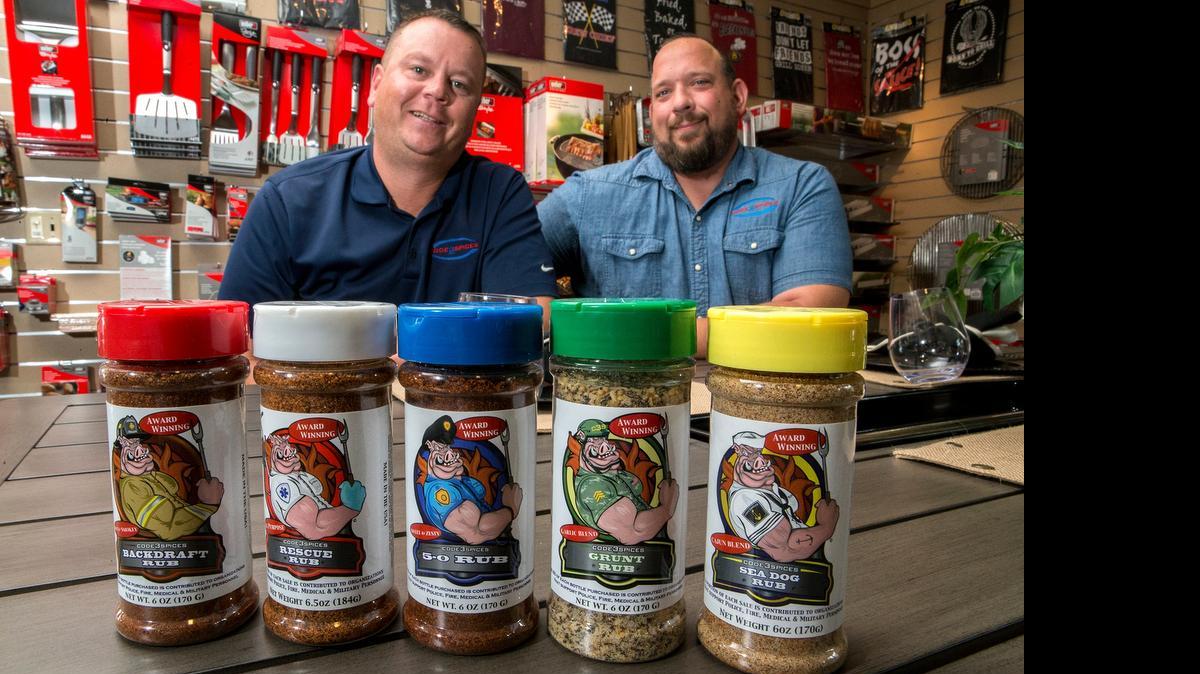 
Chris Bohnemeir (left) and Mike Radosevich with a selection of their Code 3 Spices.
