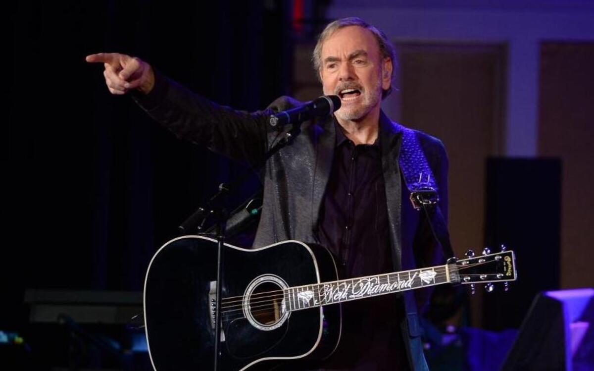 Singer-songwriter Neil Diamond performs at his former high school, Erasmus Hall High School, for his first-ever performance in his hometown in the Brooklyn borough of New York on Monday, Sept. 29, 2014.