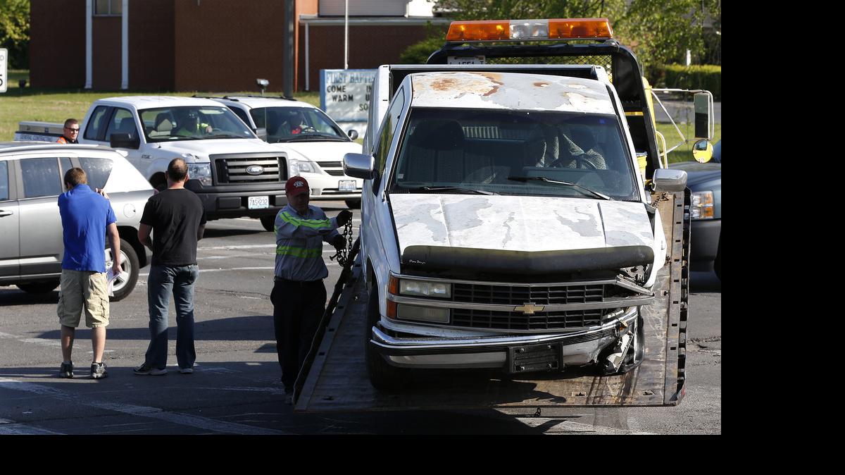 
A Chevy truck is loaded onto a tow truck after it was wrecked at the intersection of Illinois 161 and Frank Scott Parkway Thursday morning in Belleville.
