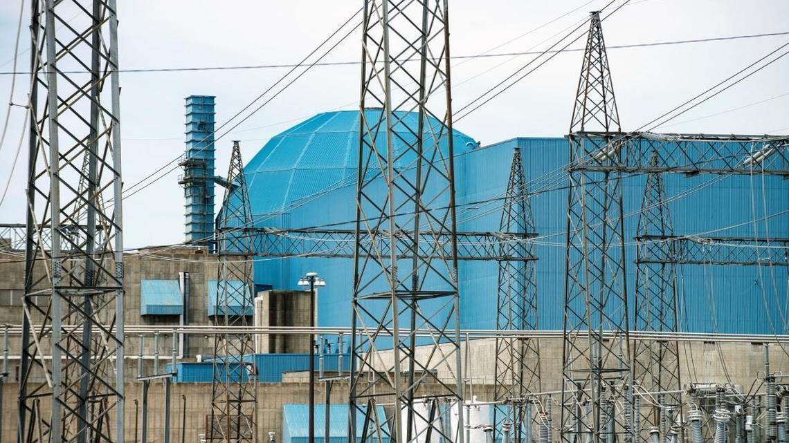 Exelon Corp.’s Clinton Power Station as seen through a tangle of high-voltage power lines in Clinton, Illinois. A massive forward-looking energy plan pushed by Exelon Corp. and derided as a multibillion-dollar bailout for two unprofitable nuclear plants in Clinton and the Quad Cities could land on Illinois legislators’ desks in the final days of the General Assembly's fall veto session.