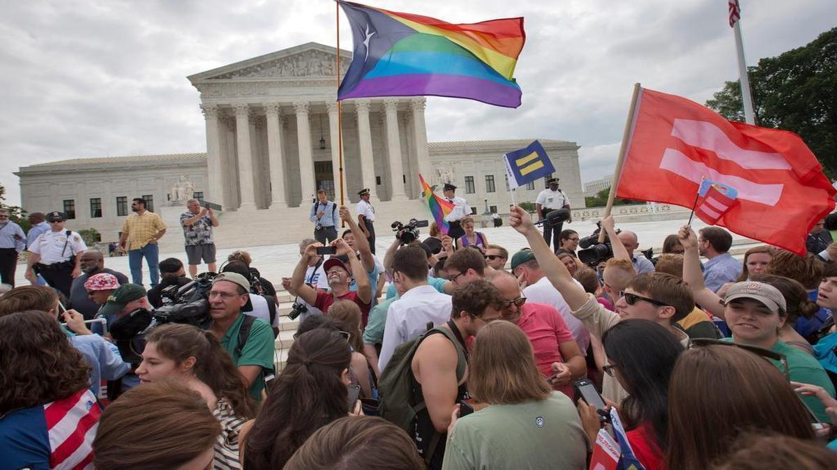 
The crowd reacts as the ruling on same-sex marriage was announced outside of the Supreme Court in Washington on Friday. The Supreme Court declared Friday that same-sex couples have a right to marry anywhere in the US.
