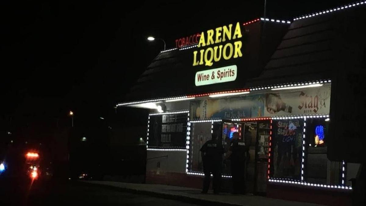 Police investigate an armed robbery at Arena Liquor in Belleville on July 13, 2017.