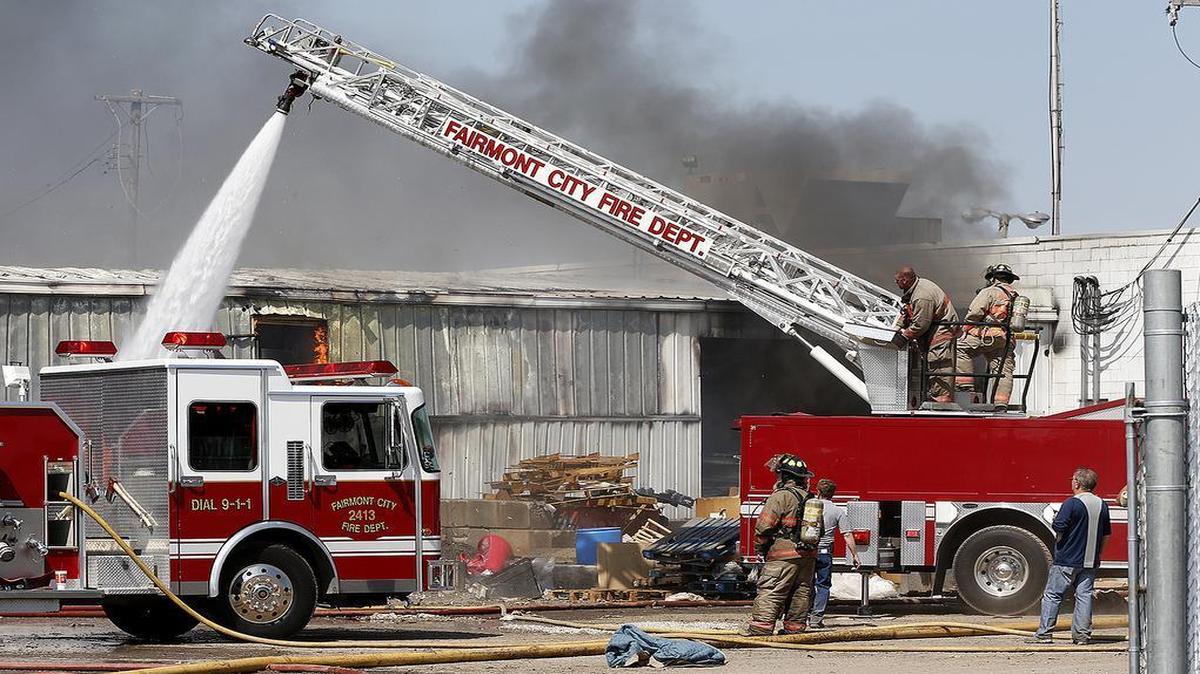 
Firefighters work at the scene of fire which destroyed Tek Recycling Sunday in Fairmont City.
