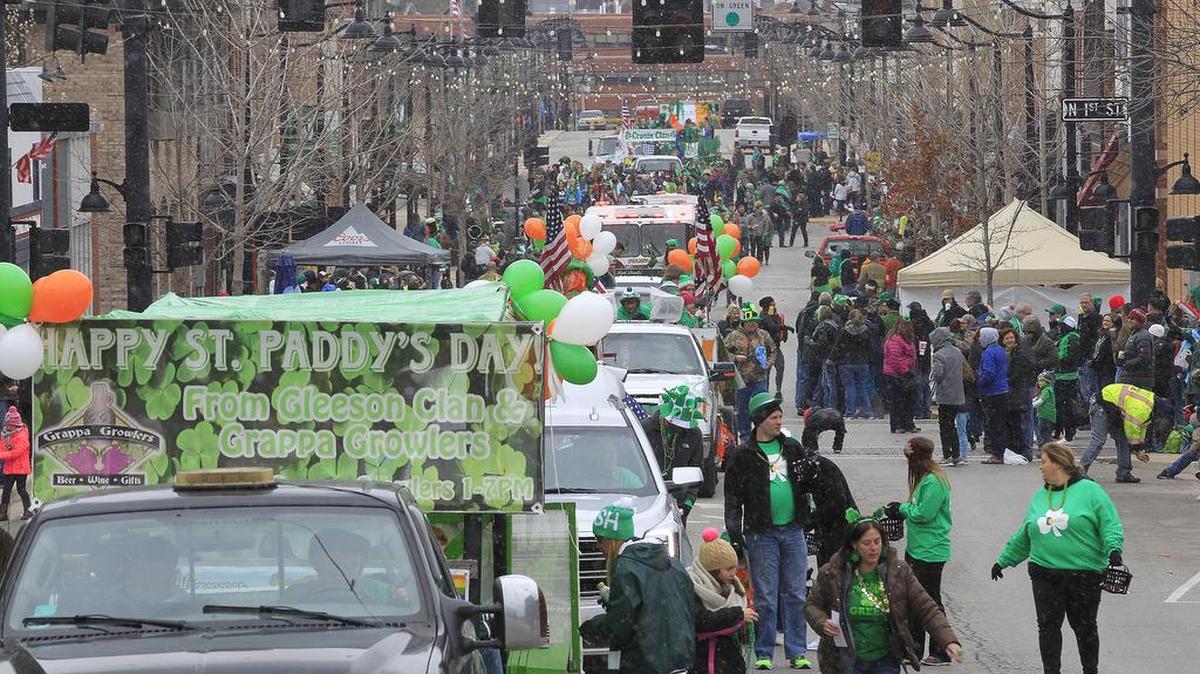 The Ancient Order of Hibernians St Patrick's Day Parade through downtown Belleville was held despite the cold and light snow flurries falling during the annual event in 2017. Crowds were smaller than in the past, but there was still a good turnout of people yelling and waving for beads and candy along the parade route. This view is from Public Square looking west on West Main Street.